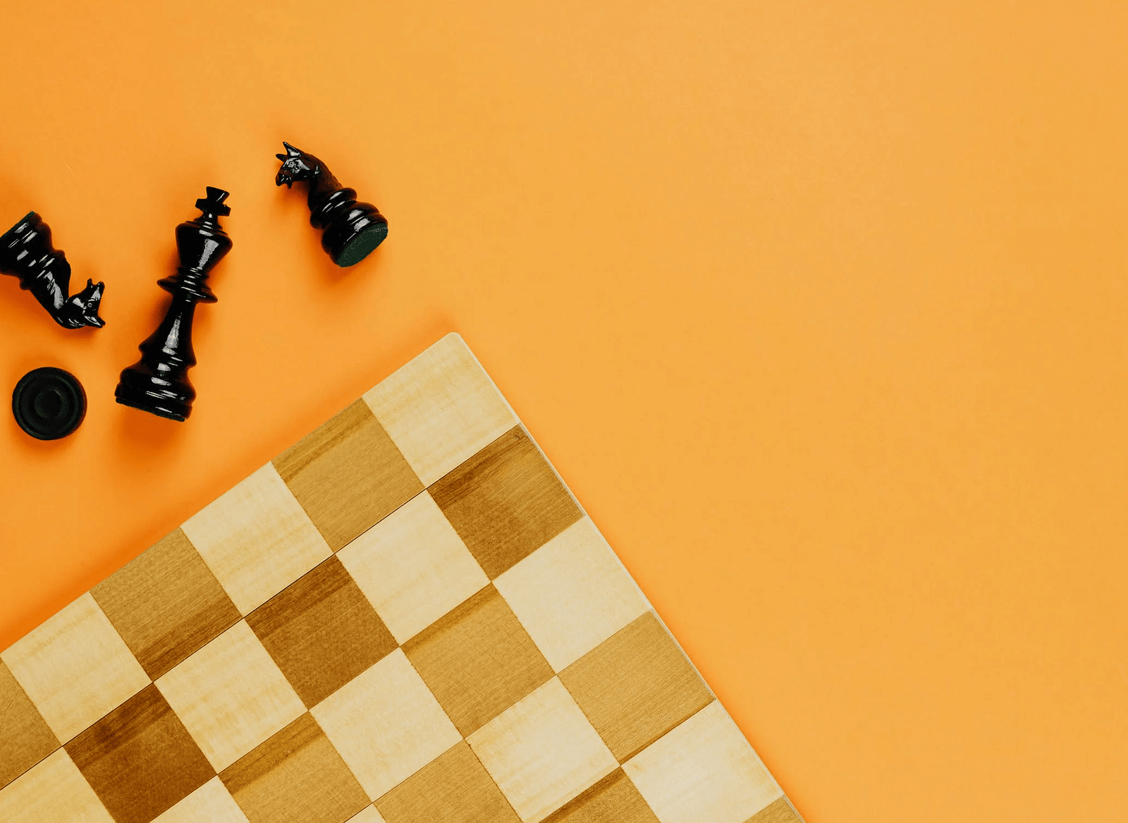 An image of a chessboard on an orange background.