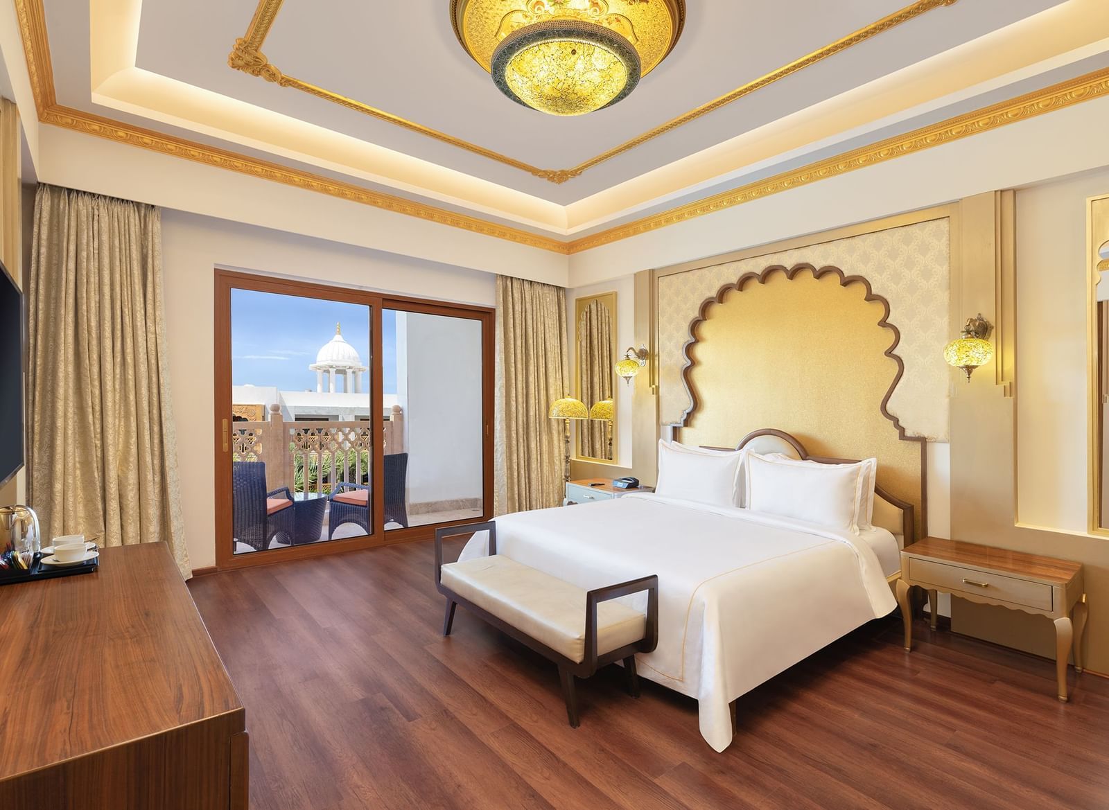 Spacious bedroom featuring crisp white linens and wide windows overlooking scenic views – Kaldan Samudra, one of the top resorts near Mahabalipuram