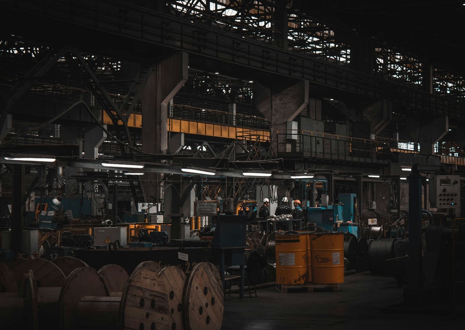 An overview of the interior of a manufacturing plant with machineries in view.