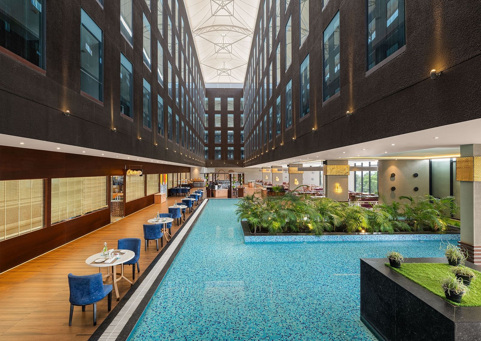 Blue Salt Cafe at Essentia Luxury Hotel, Indore with poolside seating arrangement