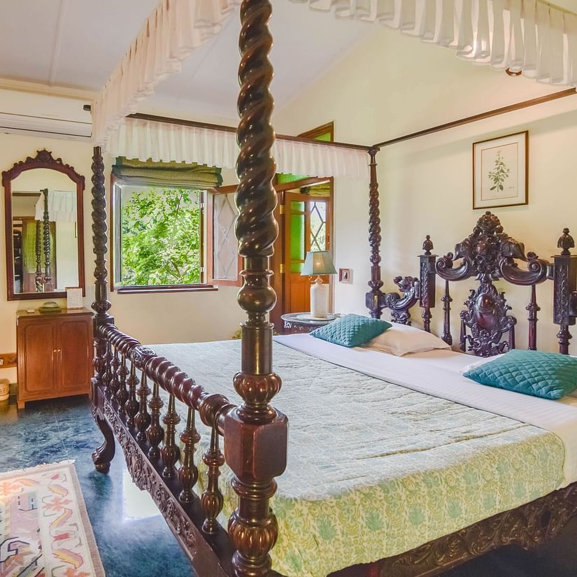 Image of interior of a Hotel Room with bed at Shaheen Bagh Resort Dehradun